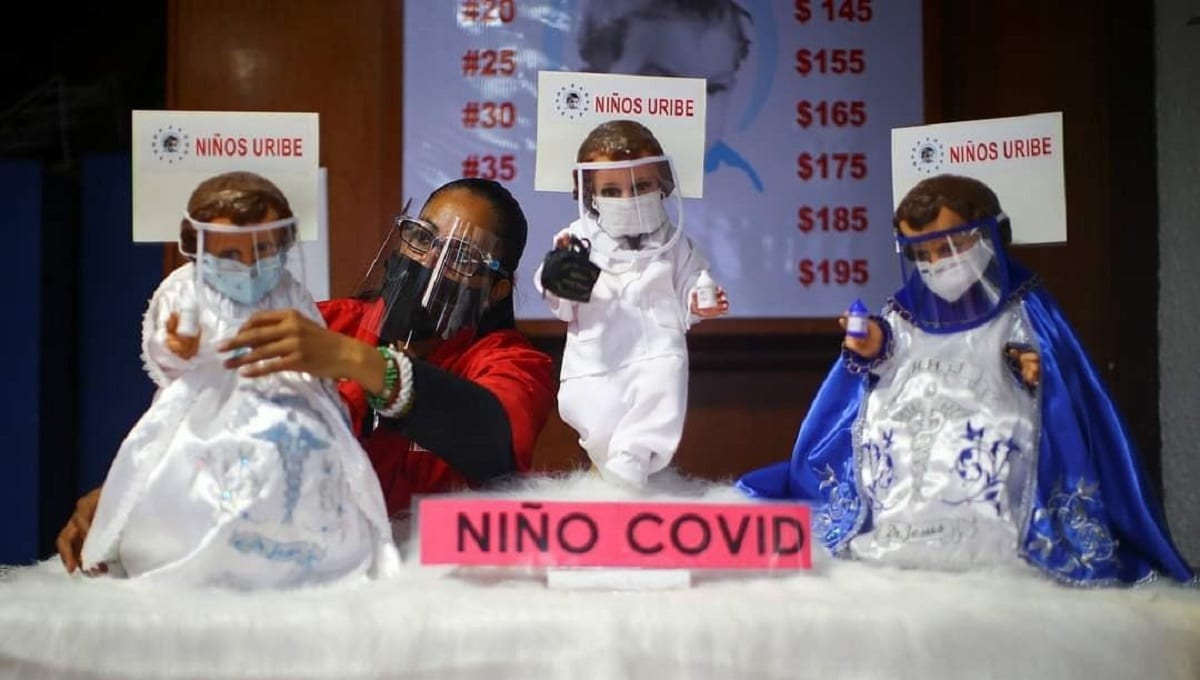 Ante pandemia de COVID-19, católicos visten al Niño Dios con careta y cubrebocas 1 careta